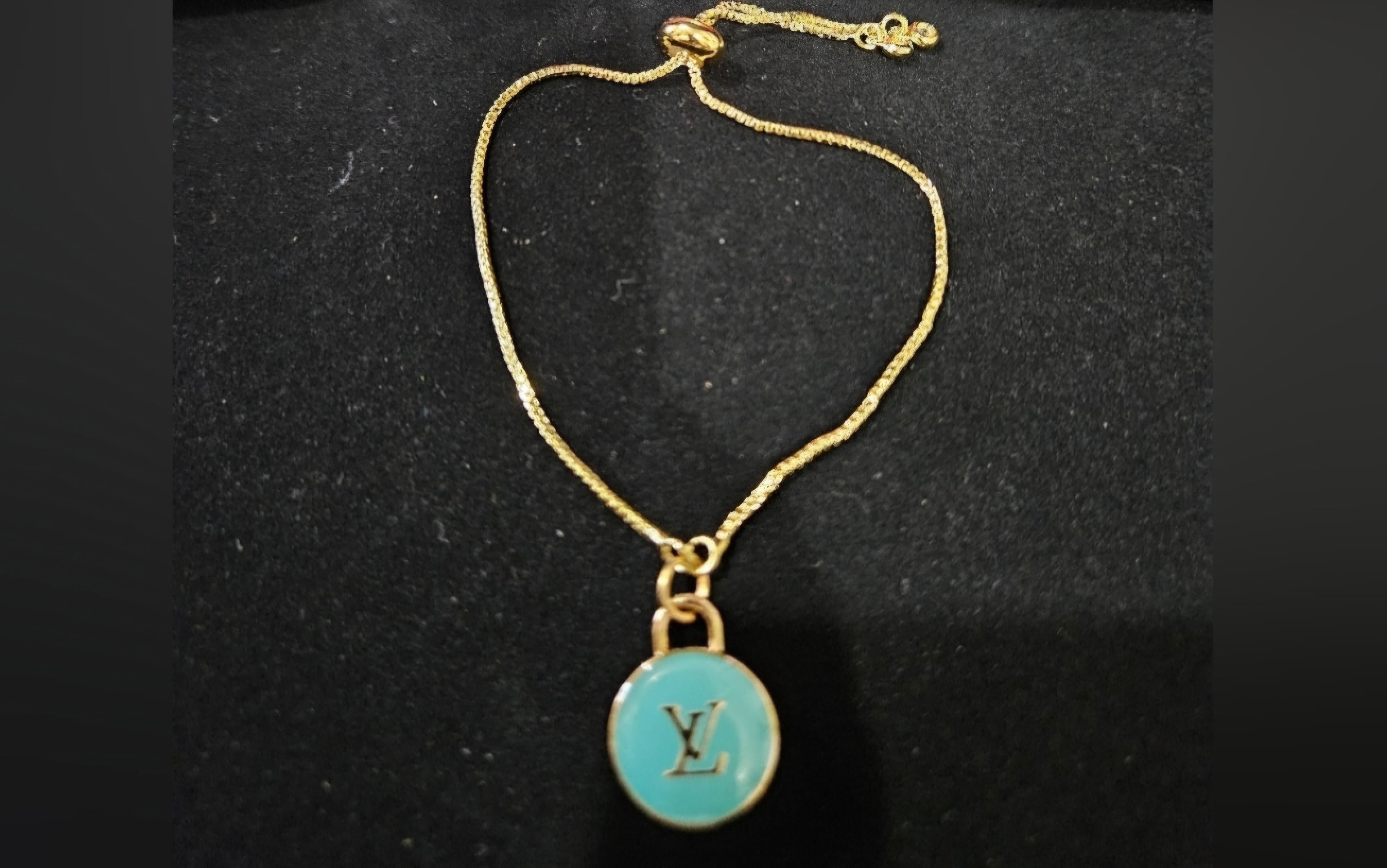 Louis Vuitton aqua charm
