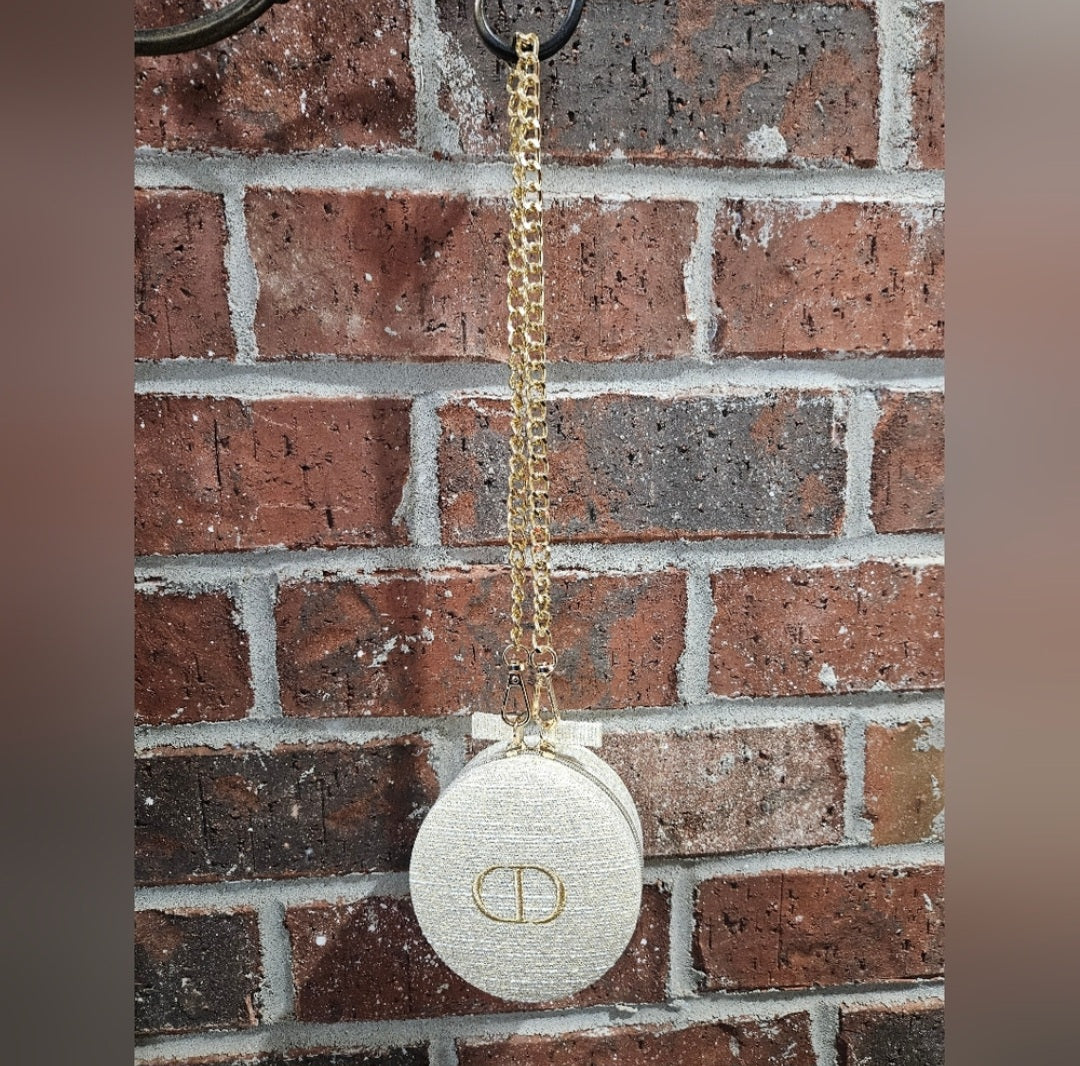 Dior round zippered pouch with gold shoulder strap