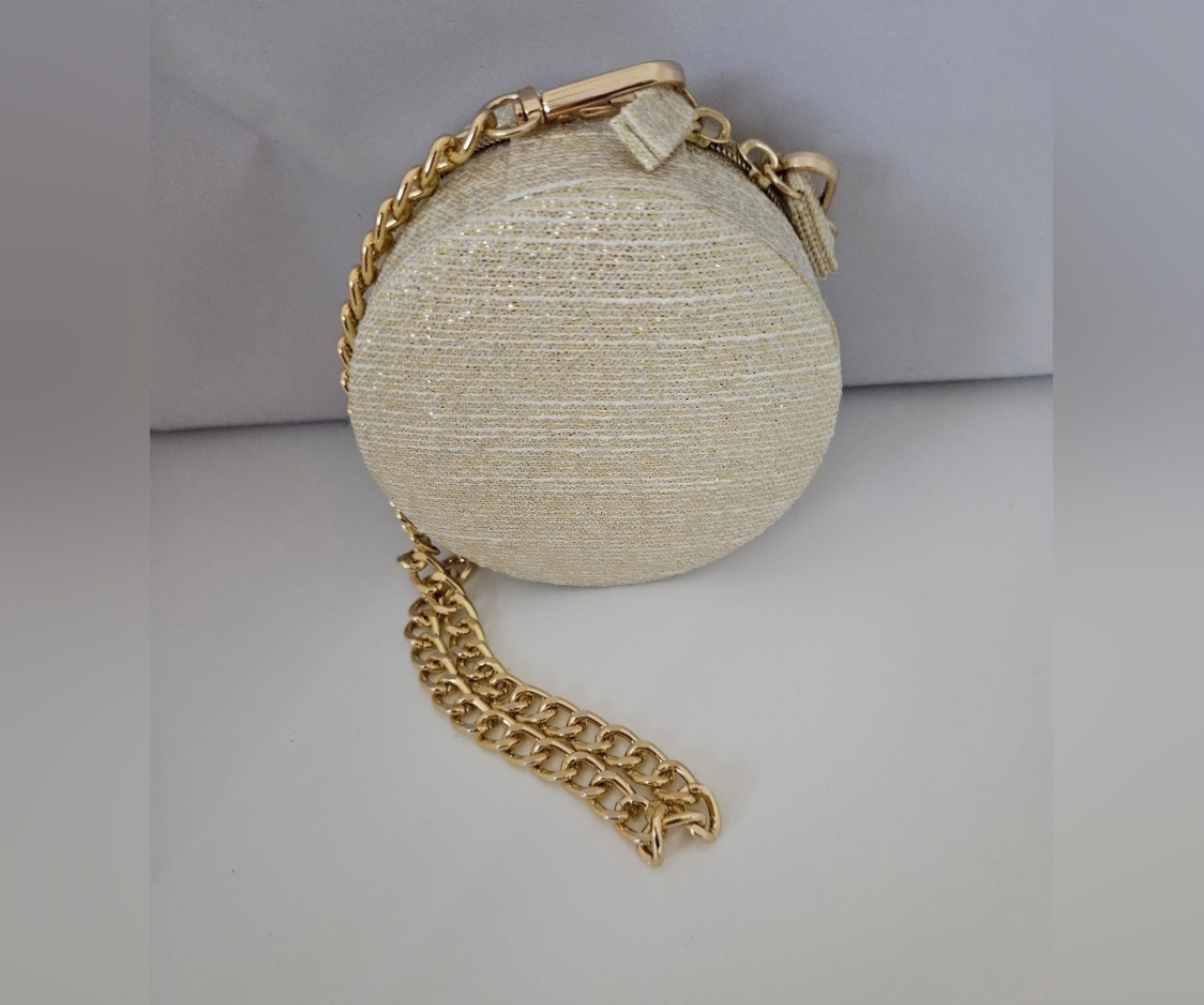 Dior round zippered pouch with gold shoulder strap