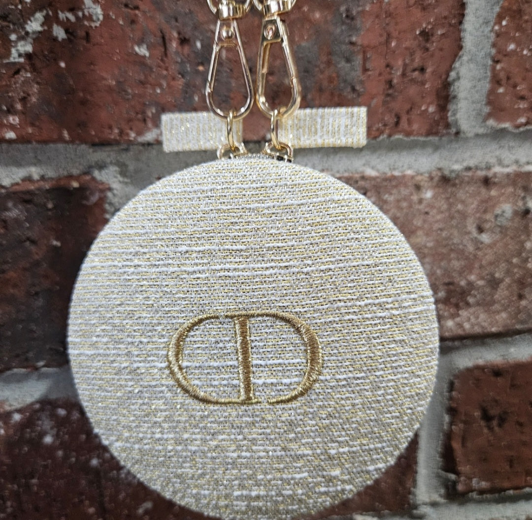 Dior round zippered pouch with gold shoulder strap