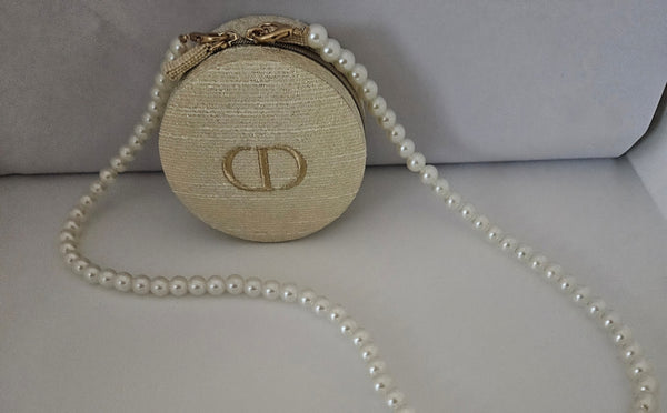Dior Round Zippered Pouch with pearl crossbody strap