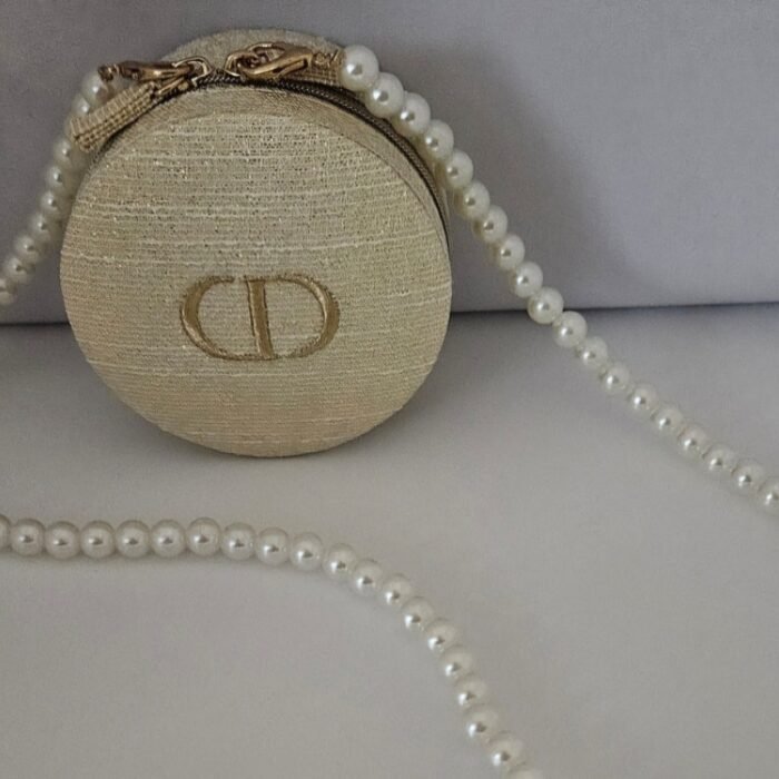 Dior Round Zippered Pouch with pearl crossbody strap
